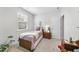 Bright bedroom featuring a single bed, plush pillows, and a nightstand with a lamp for a cozy retreat at 2323 Big Sky Ln, Raleigh, NC 27615