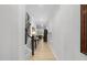 Bright hallway with light hardwood floors and access to the living area and staircase at 2323 Big Sky Ln, Raleigh, NC 27615