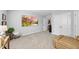Cozy living room area featuring a large screen tv and a leather recliner at 2323 Big Sky Ln, Raleigh, NC 27615