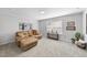 Comfortable living room with a large sofa, stylish decor, and a console table for a cozy entertaining space at 2323 Big Sky Ln, Raleigh, NC 27615