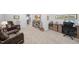 Cozy home office with a comfortable leather chair and a large desk with shelves for books and decorative items at 2323 Big Sky Ln, Raleigh, NC 27615