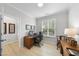 Bright office space with hardwood floors, a large window, and neutral walls at 2323 Big Sky Ln, Raleigh, NC 27615