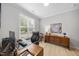 Bright office space with hardwood floors, a large window, and neutral walls at 2323 Big Sky Ln, Raleigh, NC 27615