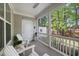Inviting screened porch featuring comfortable rocking chairs and tranquil views at 2323 Big Sky Ln, Raleigh, NC 27615