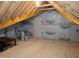 Unfinished attic with exposed rafters, plywood flooring, and a service door visible at 2472 Patriot Bluffs Dr, Fuquay Varina, NC 27526
