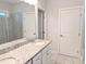 Bathroom with double vanity, granite countertop, and glass-enclosed shower at 2472 Patriot Bluffs Dr, Fuquay Varina, NC 27526