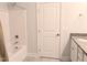 Bright bathroom featuring a shower-tub combo and vanity with granite countertop at 2472 Patriot Bluffs Dr, Fuquay Varina, NC 27526