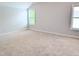 Spacious bedroom with natural light and neutral carpet, ready for personal touches at 2472 Patriot Bluffs Dr, Fuquay Varina, NC 27526