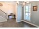 Dining room with dark hardwood floors, large windows, and modern lighting at 2472 Patriot Bluffs Dr, Fuquay Varina, NC 27526