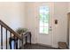 Bright entryway with hardwood floors and a glass-paneled front door at 2472 Patriot Bluffs Dr, Fuquay Varina, NC 27526