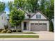 Charming one-story home with a two-car garage and a welcoming front porch at 2472 Patriot Bluffs Dr, Fuquay Varina, NC 27526