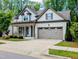 Charming one-story home with a two-car garage and a welcoming front porch at 2472 Patriot Bluffs Dr, Fuquay Varina, NC 27526