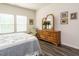Bright bedroom featuring wood floors, decor, and natural light at 253 Sweet Olive St, Clayton, NC 27527