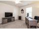Functional bedroom with a TV console, desk, and ample space at 253 Sweet Olive St, Clayton, NC 27527