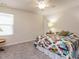 Inviting bedroom with a colorful quilt and plenty of natural light from the window at 253 Sweet Olive St, Clayton, NC 27527