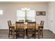 Dining room featuring a wooden table and seating for six, with natural light from a nearby window at 253 Sweet Olive St, Clayton, NC 27527