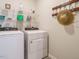 Laundry room featuring a front load washer and dryer, shelving and decor at 253 Sweet Olive St, Clayton, NC 27527