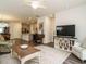 Inviting living room with a media center, cozy chairs, an open floor plan, and seamless kitchen access at 253 Sweet Olive St, Clayton, NC 27527