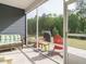 Inviting screened-in patio with comfortable seating and outdoor views at 253 Sweet Olive St, Clayton, NC 27527