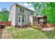 Large backyard featuring a deck, screened porch, and lush green lawn at 2639 Oleander Dr, Durham, NC 27703