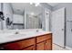 This bathroom features a double sink vanity and a decorative mirror at 2639 Oleander Dr, Durham, NC 27703