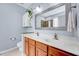 This bathroom features a double sink vanity, a large mirror, and a storage cabinet at 2639 Oleander Dr, Durham, NC 27703