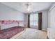 This bedroom features neutral carpet, a modern bed frame and window light at 2639 Oleander Dr, Durham, NC 27703