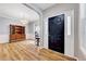 Elegant entryway with dark front door, hardwood floors, and formal dining area at 2639 Oleander Dr, Durham, NC 27703
