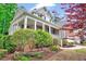 Inviting front porch with brick accents, columns, and lush landscaping at 2639 Oleander Dr, Durham, NC 27703