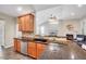 Open kitchen featuring granite countertops, a breakfast bar, and seamless flow to the living area at 2639 Oleander Dr, Durham, NC 27703