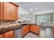 Spacious kitchen with granite countertops, stainless steel appliances, and tile backsplash at 2639 Oleander Dr, Durham, NC 27703