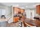 Kitchen with granite countertop island and stainless steel appliances that connects to the upstairs at 2639 Oleander Dr, Durham, NC 27703