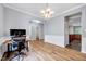 Spacious office area with hardwood floors, natural light, and neutral paint at 2639 Oleander Dr, Durham, NC 27703