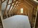 Spacious attic area with exposed wood beams at 27 Batten Hill Ln, Selma, NC 27576