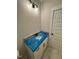 New bathroom features a granite countertop and modern light fixture at 27 Batten Hill Ln, Selma, NC 27576