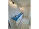 Bathroom featuring a double sink vanity with granite countertop and elegant lighting fixtures at 27 Batten Hill Ln, Selma, NC 27576