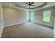 Large bedroom featuring natural light and neutral tones, creating a serene atmosphere at 27 Batten Hill Ln, Selma, NC 27576