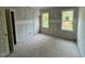 Cozy bedroom featuring two windows at 27 Batten Hill Ln, Selma, NC 27576