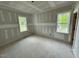 Bright bedroom with two windows at 27 Batten Hill Ln, Selma, NC 27576