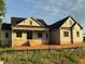 Charming home showcasing a brick foundation, covered porch, and classic architecture, perfect for modern living at 27 Batten Hill Ln, Selma, NC 27576