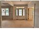 Inviting foyer with a stylish front door and transom window, creating a warm and welcoming entry space at 27 Batten Hill Ln, Selma, NC 27576