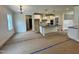 Beautiful kitchen featuring white cabinets, an island with countertop, and modern lighting at 27 Batten Hill Ln, Selma, NC 27576