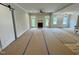Spacious living room featuring a fireplace, access to the backyard, and an open floor plan at 27 Batten Hill Ln, Selma, NC 27576