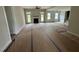Spacious living room with a cozy fireplace and ample natural light from large windows at 27 Batten Hill Ln, Selma, NC 27576