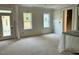 Open-concept living area with abundant natural light and outdoor access, awaiting personalized touches for modern living at 27 Batten Hill Ln, Selma, NC 27576
