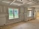 Inviting room showcasing a coffered ceiling and large window, creating a bright and airy atmosphere for relaxation at 27 Batten Hill Ln, Selma, NC 27576