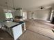 Spacious living room with fireplace and open floor plan at 27 Batten Hill Ln, Selma, NC 27576