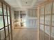 Versatile office space featuring custom built-in shelving, ideal for remote work or a cozy reading nook at 27 Batten Hill Ln, Selma, NC 27576