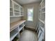 Walk-in pantry featuring built-in shelves and ample storage space, plus a window at 27 Batten Hill Ln, Selma, NC 27576