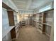 Large walk-in closet with built-in shelving and storage solutions at 27 Batten Hill Ln, Selma, NC 27576